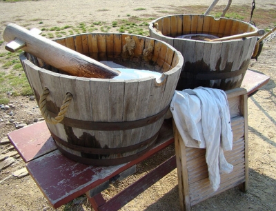 Wooden tubs with rope handles on bench